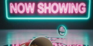 Latest Movie Showtimes Near You: Real-Time Updates Popcorn, phone, and "NOW SHOWING" sign.