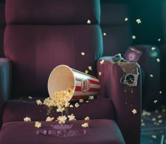 AMC vs Regal: Who Has the Best Movie-Going Experience? Spilled popcorn, broken 3D glasses, and movie theater conflict.