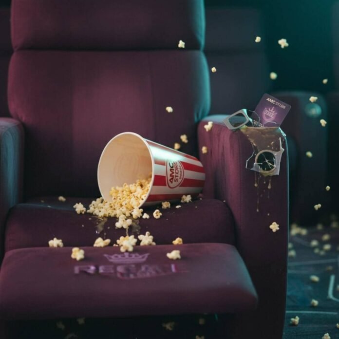 Spilled popcorn, broken 3D glasses, and movie theater conflict.