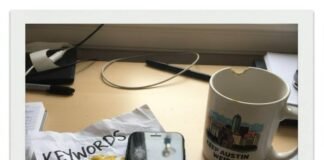 New Releases Round-Up: What Everyone’s Watching This Week Polaroid: desk, keyword printout, iPhone, mug.